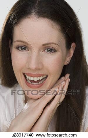 Stock Image - Close up of woman laughing. Fotosearch