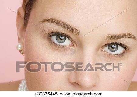 Stock Photography - Close up of woman wearing pearls. Fotosearch