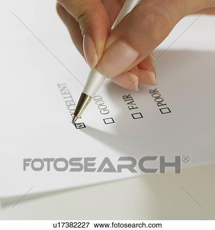 Close up of woman's hand marking check box with pen View Large Photo Image Stock Photo - Close up of woman's hand marking check box with pen. Fotosearch