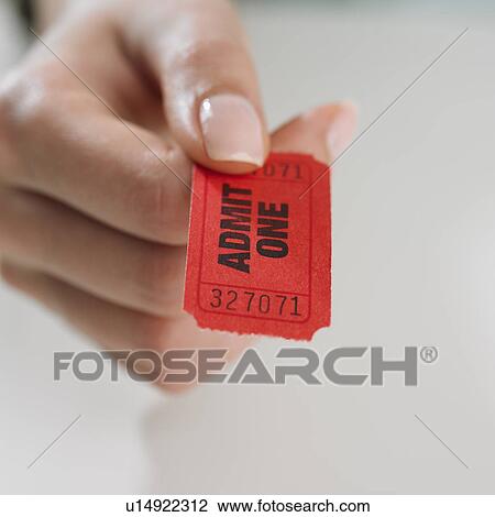 Close up studio shot of woman's hand holding ticket View Large Photo Image Stock Image - Close up studio shot of woman's hand holding ticket. Fotosearch