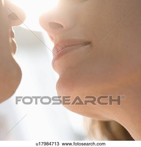 Closeup from below of couple kissing View Large Photo Image Stock Image - Closeup from below of couple kissing. Fotosearch