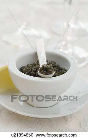 Stock Image - Closeup of a bowl of caviar. Fotosearch