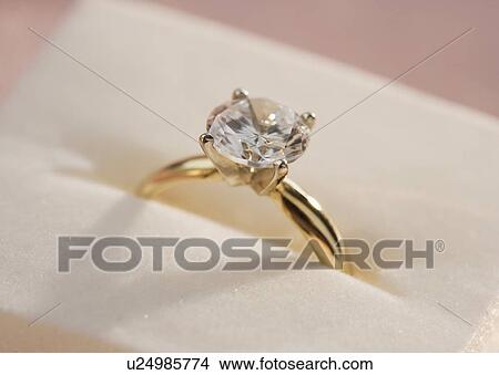 Picture - Closeup of a diamond engagement ring. Fotosearch