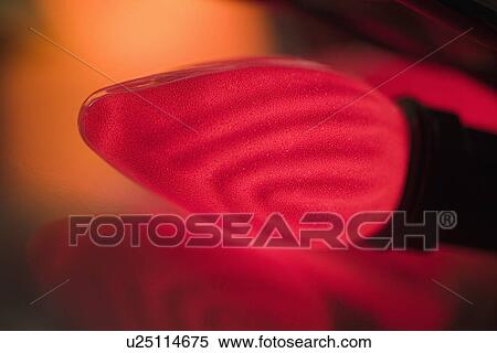 Stock Photography - Closeup of a glowing Christmas light bulb. Fotosearch