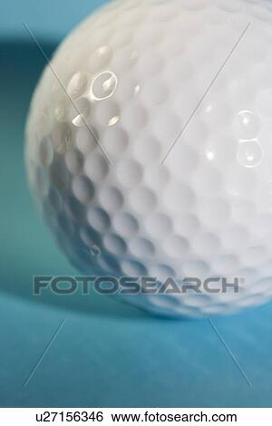 Stock Photograph - Closeup of a golf ball. Fotosearch