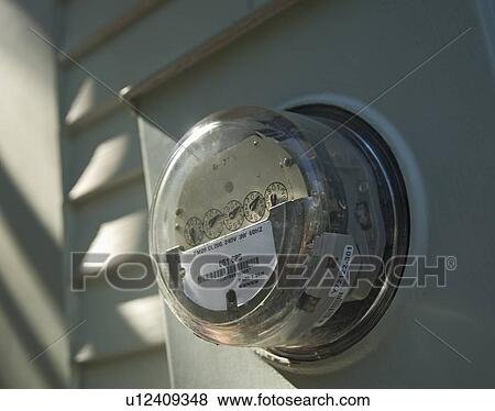 Stock Photo - Closeup of a home electric meter. Fotosearch