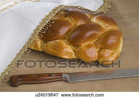 Stock Photo - Closeup of a loaf of challah bread. Fotosearch