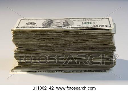 Stock Image - Closeup of a stack of American money. Fotosearch