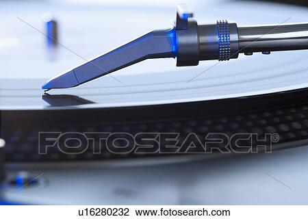 Stock Image - Closeup of a turntable and record. Fotosearch