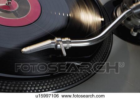Closeup of a turntable and record View Large Photo Image Stock Photograph - Closeup of a turntable and record. Fotosearch