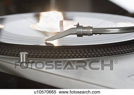 Stock Photography - Closeup of a turntable and record. Fotosearch