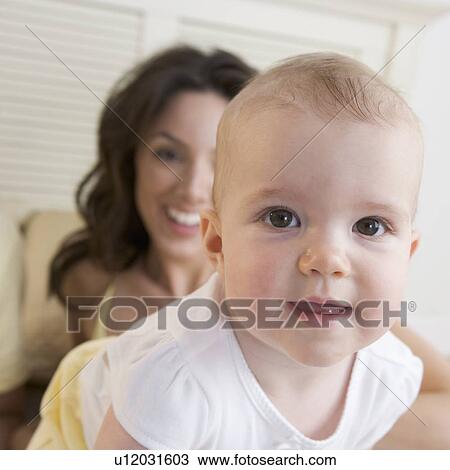 Closeup of baby with mother View Large Photo Image Stock Image - Closeup of baby with mother. Fotosearch
