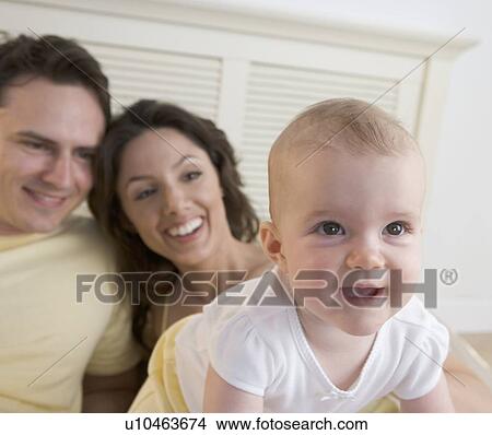 Closeup of baby with parents View Large Photo Image Picture - Closeup of baby with parents. Fotosearch