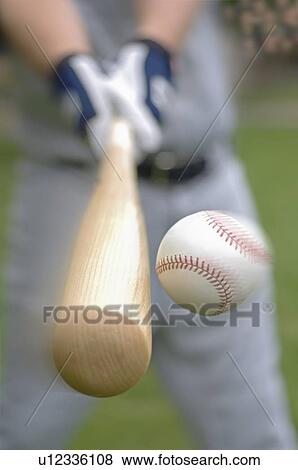 Closeup of baseball player hitting ball View Large Photo Image Stock Photo - Closeup of baseball player hitting ball. Fotosearch
