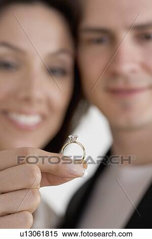 Closeup of blurred couple with ring View Large Photo Image Stock Photography - Closeup of blurred couple with ring. Fotosearch