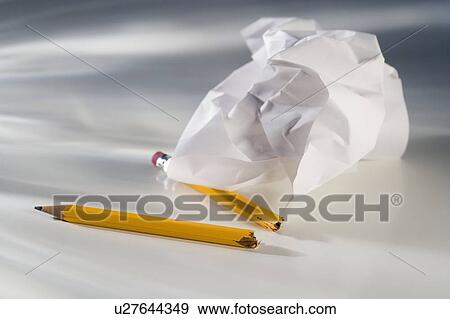 Closeup of broken pencil and crumpled paper View Large Photo Image Stock Photo - Closeup of broken pencil and crumpled paper. Fotosearch