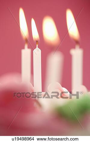 Closeup of candles on a cake View Large Photo Image Picture - Closeup of candles on a cake. Fotosearch