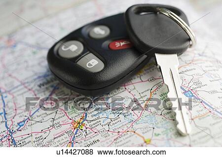 Stock Photo - Closeup of car keys and map. Fotosearch