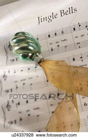 Closeup of Christmas ornanament and music View Large Photo Image Stock Photo - Closeup of Christmas ornanament and music. Fotosearch