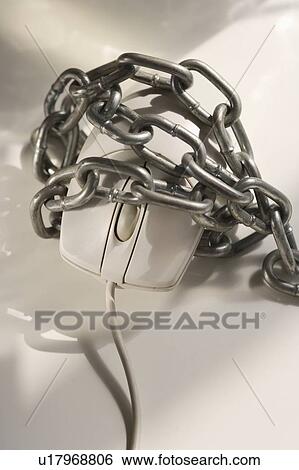 Stock Photograph - Closeup of computer mouse covered in chains. Fotosearch