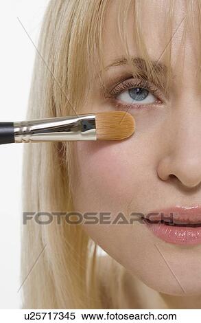 Closeup of cosmetic brush on face View Large Photo Image Stock Photography - Closeup of cosmetic brush on face. Fotosearch
