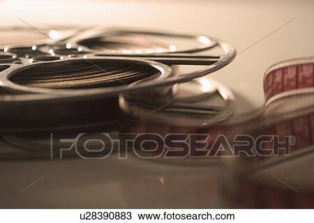 Closeup of film reel unrolling View Large Photo Image Stock Image - Closeup of film reel unrolling. Fotosearch