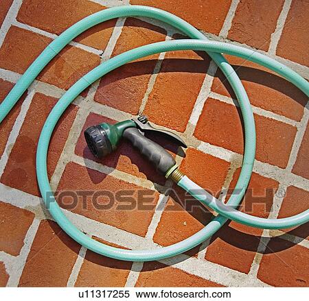 Closeup of garden hose and brick floor View Large Photo Image Stock Photography - Closeup of garden hose and brick floor. Fotosearch