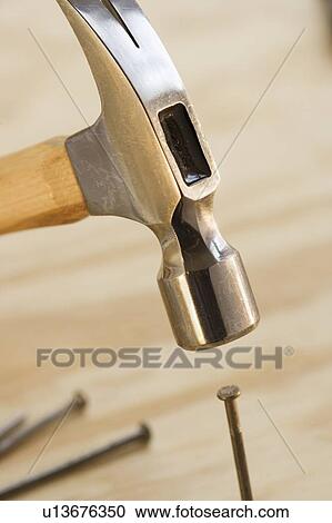 Closeup of hammer and nail View Large Photo Image Stock Image - Closeup of hammer and nail. Fotosearch