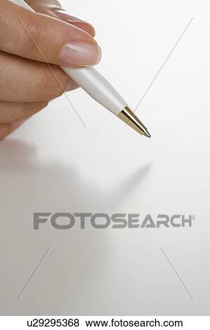 Closeup of hand holding pen View Large Photo Image Stock Photo - Closeup of hand holding pen. Fotosearch
