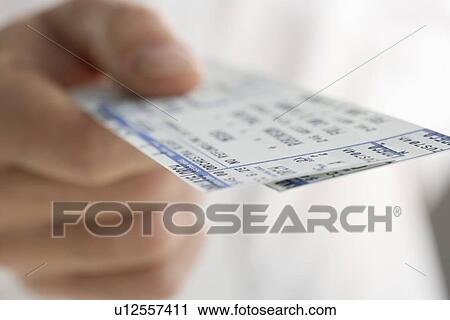 Closeup of hand holding tickets View Large Photo Image Stock Image - Closeup of hand holding tickets. Fotosearch