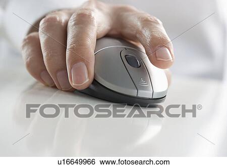 Stock Photograph - Closeup of hand pressing mouse button. Fotosearch
