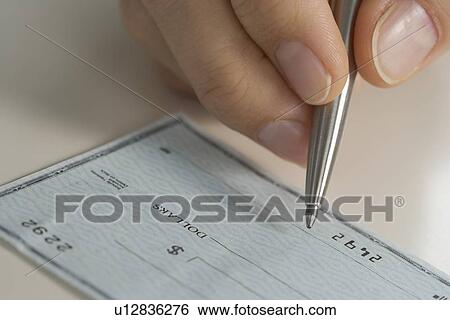 Closeup of hand writing check View Large Photo Image Stock Photograph - Closeup of hand writing check. Fotosearch