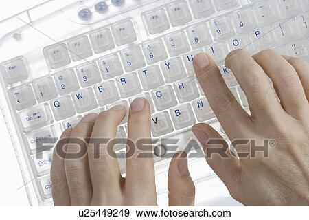 Closeup of hands on transparent keyboard View Large Photo Image Stock Photo - Closeup of hands on transparent keyboard. Fotosearch