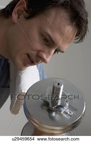 Picture - Closeup of man weight training. Fotosearch