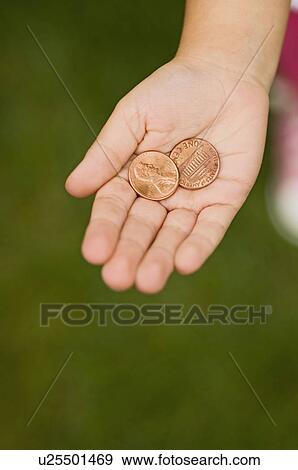 Closeup of pennies in childs palm View Large Photo Image Stock Photo - Closeup of pennies in childs palm. Fotosearch