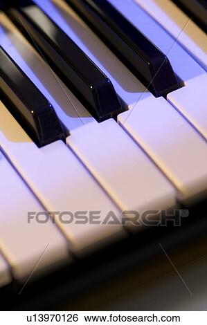 Stock Photograph - Closeup of piano keys. Fotosearch