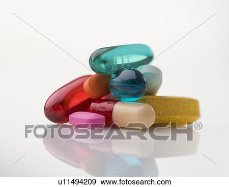 Closeup of pile of multi-colored pills View Large Photo Image Stock Photo - Closeup of pile of multi-colored pills. Fotosearch