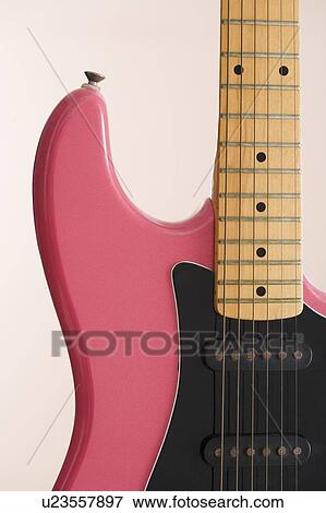 Closeup of pink electric guitar View Large Photo Image Stock Photo - Closeup of pink electric guitar. Fotosearch
