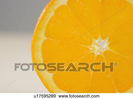 Stock Photo - Closeup of round orange slice. Fotosearch