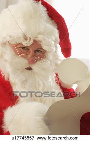 Closeup of Santa checking his list View Large Photo Image Stock Photo - Closeup of Santa checking his list. Fotosearch