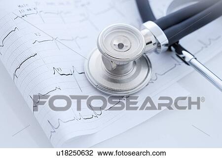 Stock Image - Closeup of stethoscope on monitor printout. Fotosearch