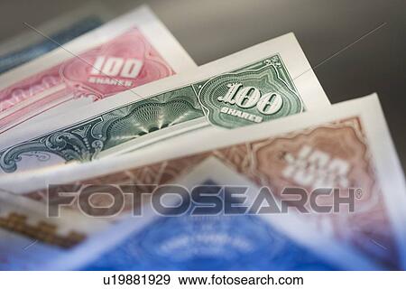 Stock Photo - Closeup of stock shares. Fotosearch