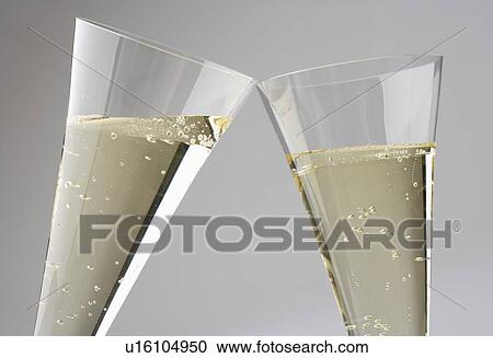 Closeup of toasting with champagne glasses View Large Photo Image Stock Image - Closeup of toasting with champagne glasses. Fotosearch