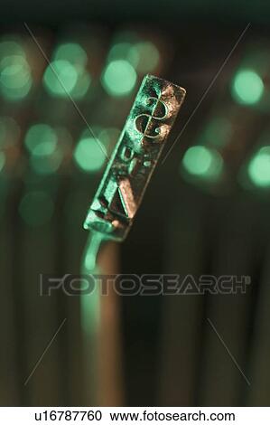 Stock Image - Closeup of typewriter printing plate. Fotosearch