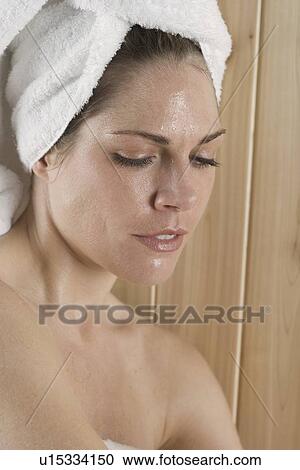 Stock Image - Closeup of woman in sauna. Fotosearch
