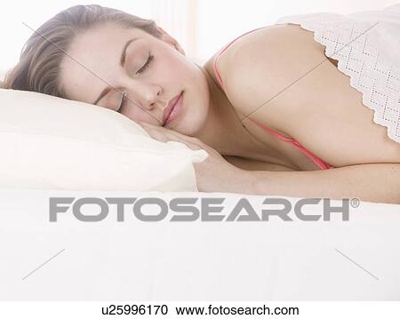 Stock Image - Closeup of woman sleeping. Fotosearch
