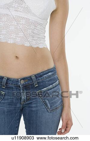 Stock Image - Closeup of woman's midriff. Fotosearch