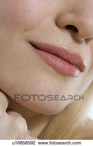 Closeup of woman's mouth and hand View Large Photo Image Stock Image - Closeup of woman's mouth and hand. Fotosearch