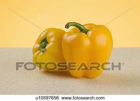 Stock Photograph - Closeup of yellow peppers. Fotosearch