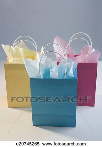 Colorful gift bags with tissue paper View Large Photo Image Stock Photography - Colorful gift bags with tissue paper. Fotosearch